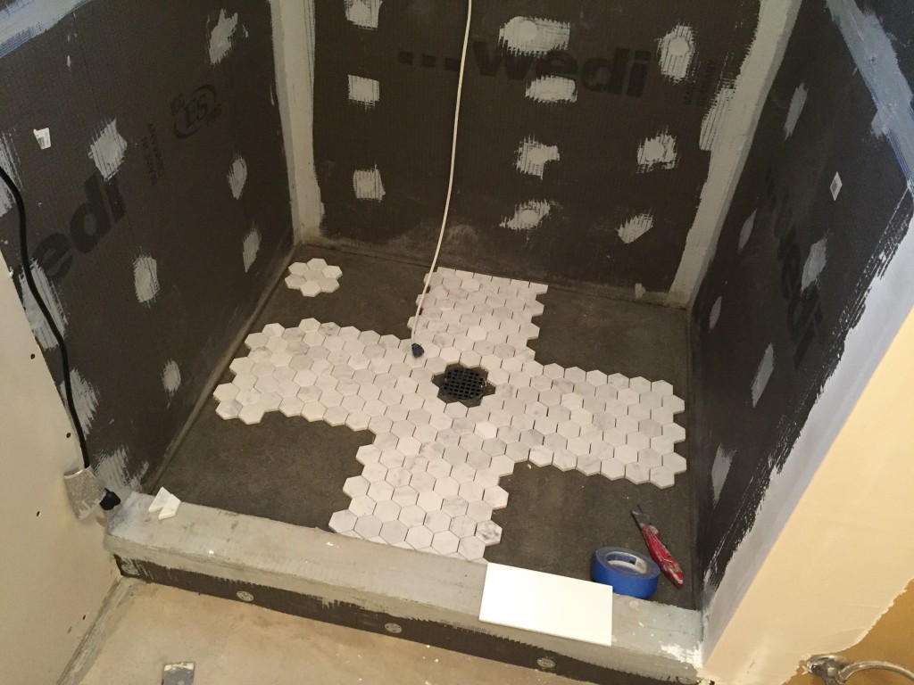 {Our tile contractor, Misha, used such precision to lay out the tile in the shower. We continue to be amazed and impressed by how wonderful and thoughtful he is!}