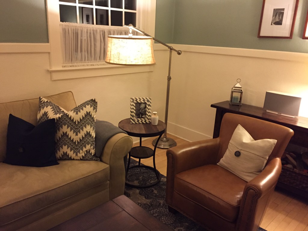 {We're really excited about the new leather chairs, the funky side tables, the new rug and the awesome new lamp. We're so pleased that we were able to pull it all together!}
