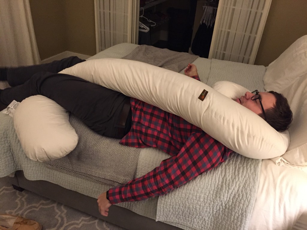 {I got a big body pillow to help me sleep more comfortably on my side now and Alex has taken it over...}