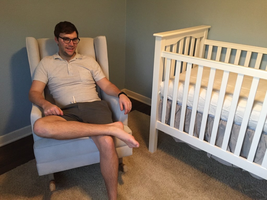 {The proud dad-to-be testing out the rocker... it passes the comfort test for sure!}