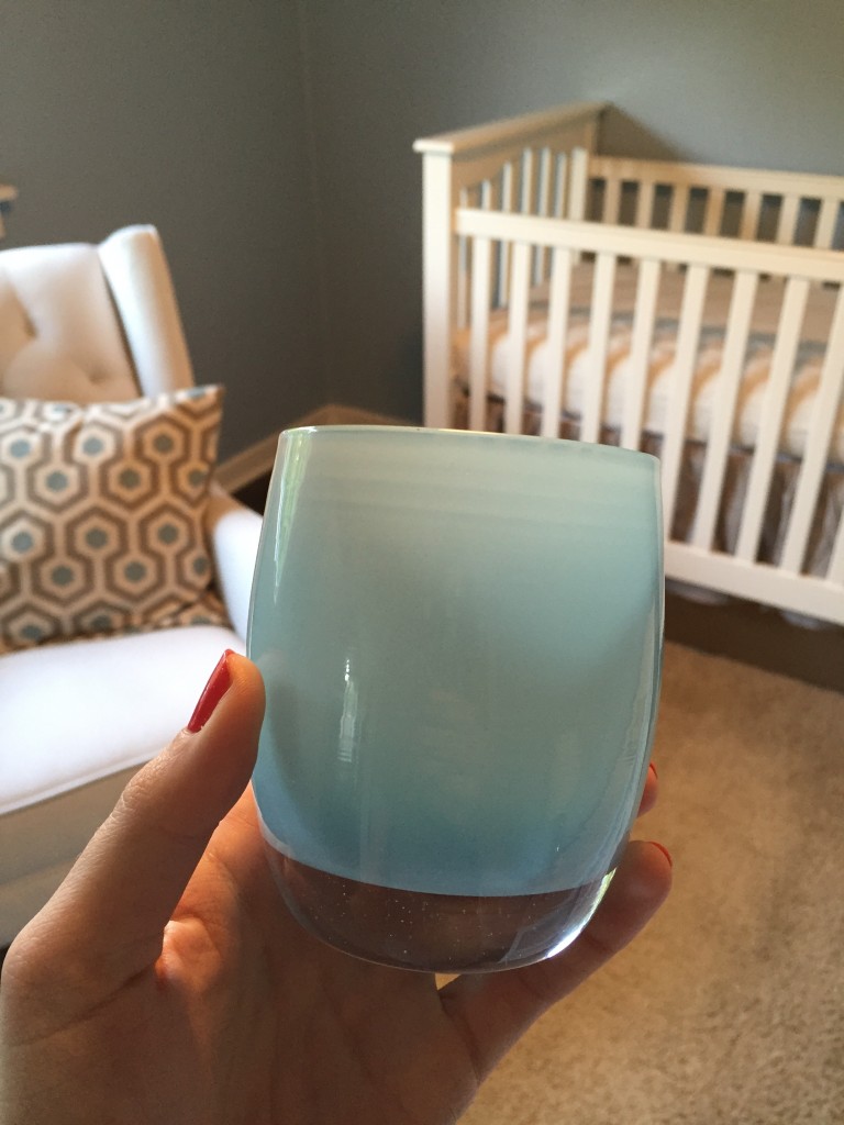 {Fun shot of the rocker and crib, along with our newest Glassybaby, in the shade of "Little Boy Blue" for our little boy.}