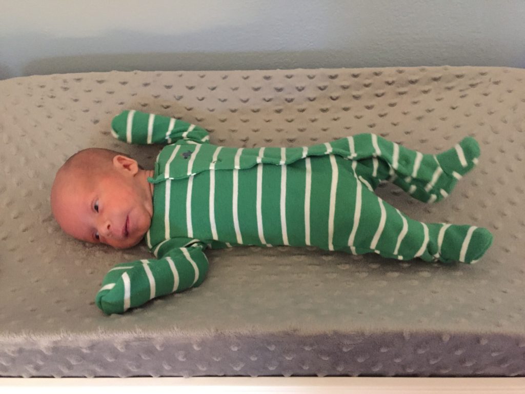 {This little guy sure is growing! He's growing right out of his smallest preemie clothes already. Ben has a "growth check" doctor's appointment next week and we're excited to hear how tall he is. His last weight was on Sunday and he weighed 5 pounds 6 ounces.}