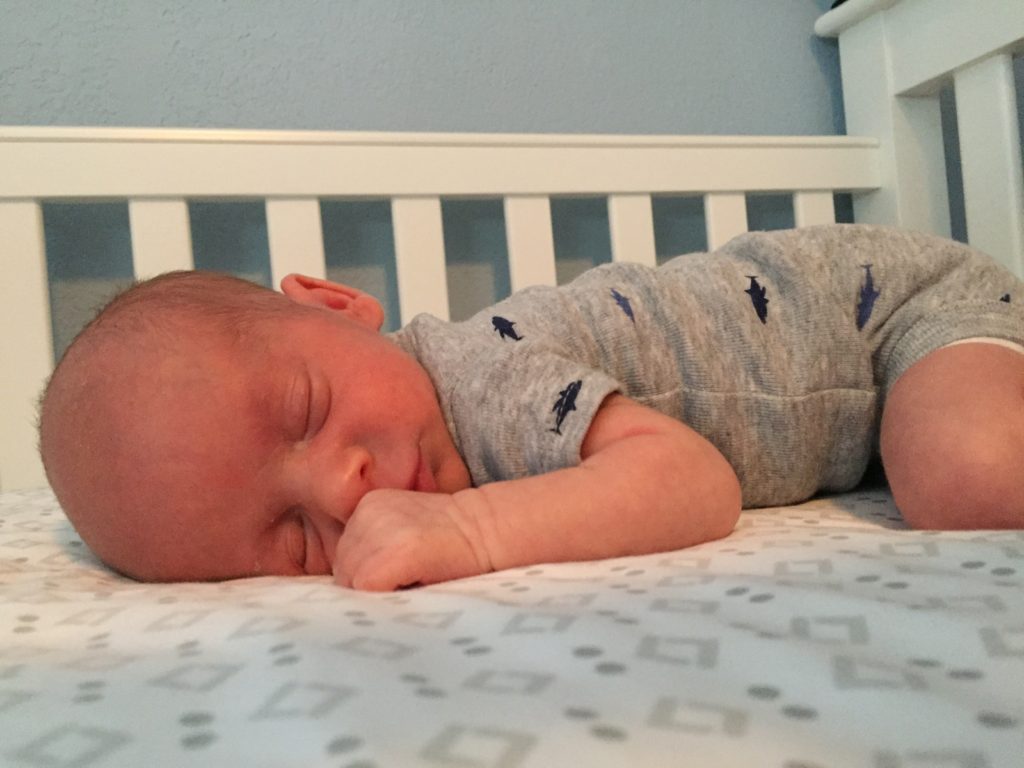 {Ben has been getting used to tummy time! We've been incorporating it into his diaper change/feeding routine so he's been spending a small amount of time on his belly several times throughout the day.}