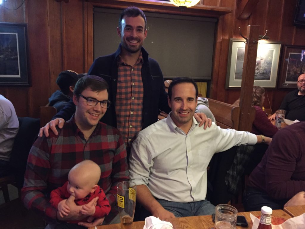 {Baby in a bar! AK, Alex's best man, and Dane, a lifelong friend, got to meet Ben too.}